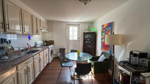 a kitchen with a table and chairs in a room at Cozy Brooklyn Home, Private Room in Host Shared Apartment in Brooklyn