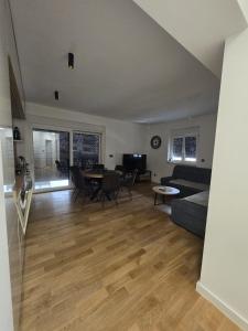 a living room with a couch and a table at Eis in Brodarica +16 photos