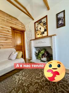 a bedroom with a bed and a fireplace at Краківська 34 не далеко від ж д вокзалу Звітні документи in Lviv