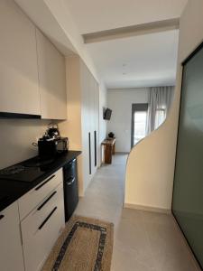 Kuchyň nebo kuchyňský kout v ubytování Casa Dei Luxury Sea View Apartmemts + 11 fotografií