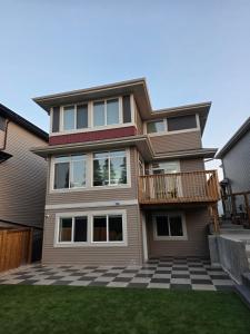 a house with a porch and a deck at The Walkout at the Ravine in Edmonton
