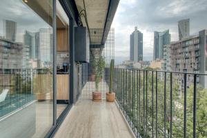 a balcony with a view of a city skyline at Myla Chapultepec in Mexico City