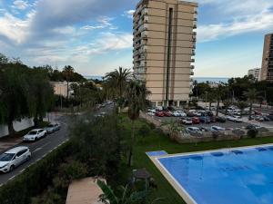 a view of a parking lot and a large building at Studio 200 m from the sea in Aguadulce