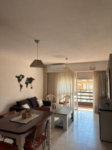a living room with a couch and a table at Bnb Loft XXIV in Rosario