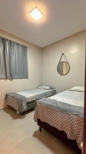 Ένα ή περισσότερα κρεβάτια σε δωμάτιο στο Cozy Apartment