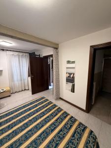 Un pat sau paturi într-o cameră la Appartamento Carboncina