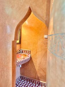 a bathroom with a sink in a room at Riad Tasneem in Marrakesh +89 photos