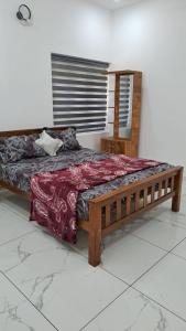 Postel nebo postele na pokoji v ubytování Daffodiles Home Stay Varkala