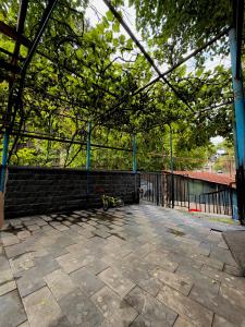 a patio with a fence and a bike on the ground at Nest Stay in Tbilisi City +20 photos