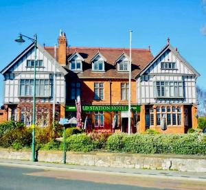 a large building on the side of a street at Denzels Den Apartment 2 in Llandudno Junction