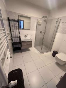 Ένα μπάνιο στο Apartament Turkusowy 5 Mórz
