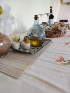 a table with a bottle of oil and some mushrooms at EnGaliciaEs - Casa alquiler turistico en ingles!  +6 photos