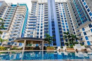 a view of a large apartment building with a swimming pool at Mivela Residences in Cebu City