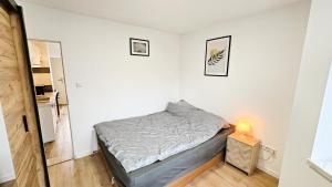 Ένα ή περισσότερα κρεβάτια σε δωμάτιο στο Apartament Antoni