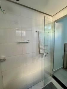 a bathroom with a shower with a glass door at Residencial Leste Universitário in Goiânia +15 photos