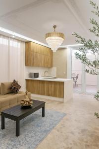 a living room with a couch and a table at Soho elegance near beach & center 2 bedrooms terrasse in Essaouira