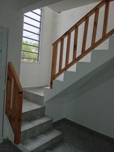 a staircase in a house with a window at Duplex La Luna in Mar del Tuyú