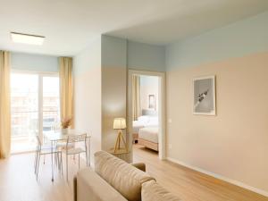 a living room with a couch and a bedroom at Smart Budget EDITION - Cozy Apartment in Golem