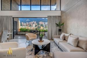 a living room with a couch and a table at Morph 1401 - Luxe & bright ap in Poblado with AC in El Poblado
