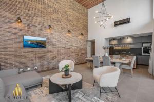 a living room with a couch and chairs and a table at Morph 1401 - Luxe & bright ap in Poblado with AC in El Poblado