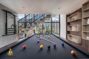 a pool table with balls on it in a house at Morph 1401 - Luxe & bright ap in Poblado with AC in El Poblado