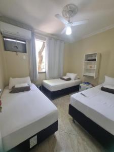 Postel nebo postele na pokoji v ubytování Quarto Aeroporto Galeão