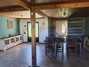 a dining room with a table and chairs at Casa de campo in San Pedro