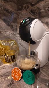 a kitchen mixer sitting on top of a counter at JOJO Loft Comfort Dzelzavas & Cozy Stay & Breakfast Gift in Riga
