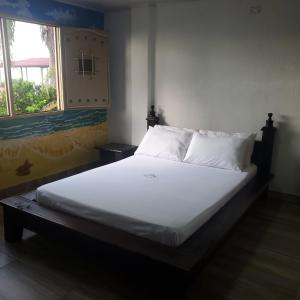 Ένα ή περισσότερα κρεβάτια σε δωμάτιο στο Rancho jr