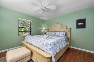 a bedroom with a bed and a ceiling fan at Crystal River Tropical Oasis Heated Pool-3 mins Sister Spring in Crystal River +67 photos