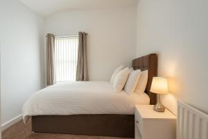 Voodi või voodid majutusasutuse Modern and Spacious House for a Comfortable Stay toas