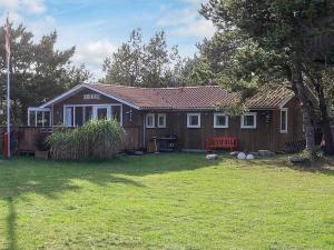a house with a yard in front of it at 6 person holiday home in Thisted in Thisted