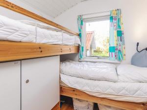 En eller flere senge i et værelse på 6 person holiday home in Thisted