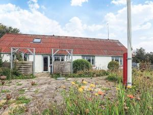 a white house with a red roof at 6 person holiday home in Vestervig in Vestervig