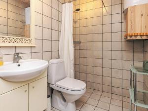 a bathroom with a toilet and a sink at 4 person holiday home in Vestervig-By Traum in Vestervig