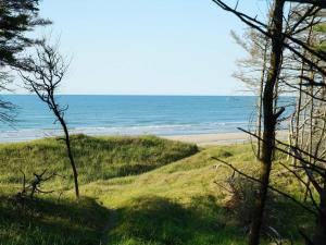a path to the beach with the ocean in the background at Secluded Oasis with Pool - By Traum Ferienwohnungen in Skram