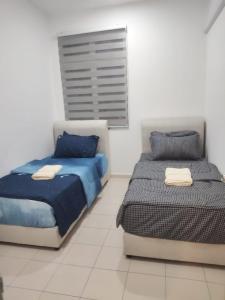 Un pat sau paturi într-o cameră la Townixi Stay