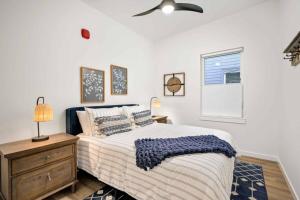 a bedroom with a bed and a window at Ebb916 Modern Loft, Heart of Taft District, Walkable to Beach in Lincoln City