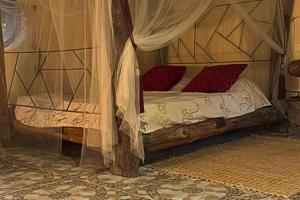 Un pat sau paturi într-o cameră la Wassado Cultural Resort