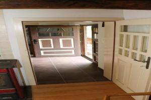 an open door to a room with a door at Holiday Home Stara Murva - Three Bedroom Holiday Home with Patio in Tuheljske Toplice