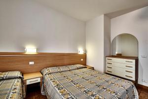 Posteľ alebo postele v izbe v ubytovaní Residence Columbia