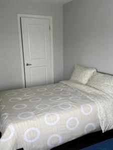 a bedroom with a bed and a white door at One Bet room in Whitby