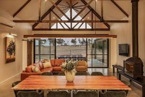 a living room with a table and a couch at The Cheese Factory - Luxe Design & Wine Country Calm in Cowaramup