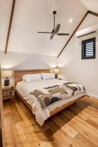 a bedroom with a bed and a ceiling fan at The Cheese Factory - Luxe Design & Wine Country Calm in Cowaramup