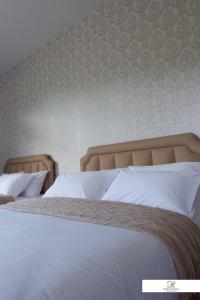 Ένα ή περισσότερα κρεβάτια σε δωμάτιο στο K Garden Homestay Chiang Rai