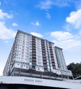 a tall apartment building with the words emerald avenue at CAMERON HIGHLAND CENRTUM BRINCHANG Homestay By Dcozy 6-7pax in Brinchang +18 photos