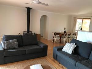 a living room with a couch and a table at Southside at Vivonne in Vivonne Bay