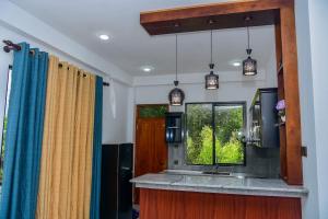 a kitchen with a sink and a window at Urban Nest Apartment in Gampola