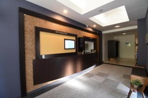a lobby with a flat screen tv on a wall at Hotel Mare - Vacation STAY 24956v in Kure