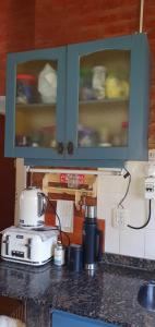 a kitchen counter with a toaster on a counter top at El descanso soñado in Chapadmalal +6 photos